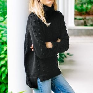 Black tuckernuck alice sweater with poms